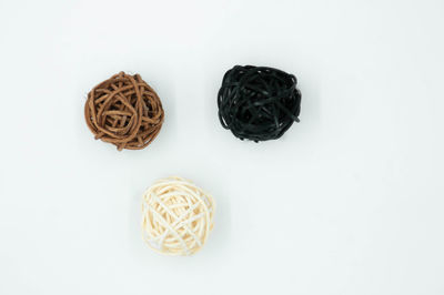 High angle view of candies against white background