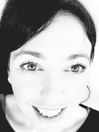 Close-up portrait of smiling young woman