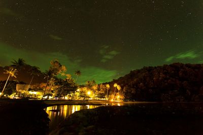 Scenic view of landscape against sky at night