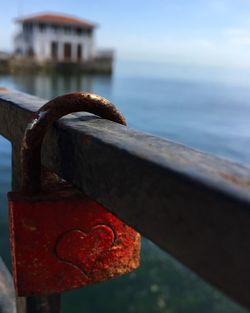 Close-up of padlocks on railing