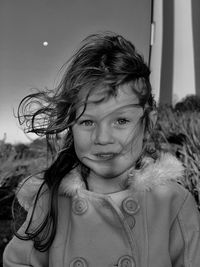 Portrait of girl standing outdoors