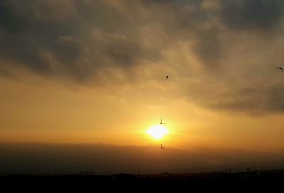 Scenic view of silhouette landscape against sky during sunset