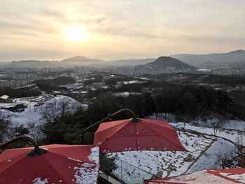 Scenic view of landscape against sky at sunset