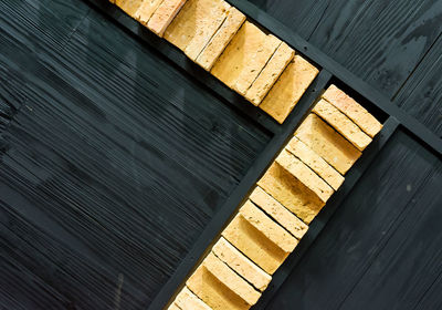 High angle view of wooden floor against wall