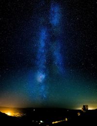 Blue milky way in sky over corfe castle