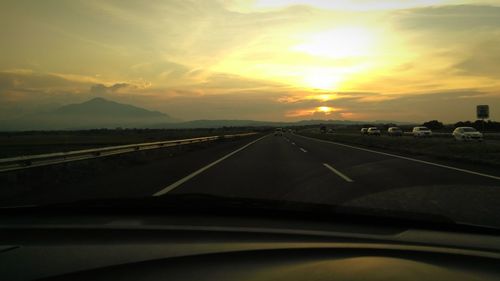 Road passing through car windshield