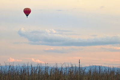 Hot air balloon against sky during sunset