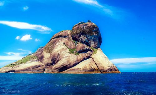 Scenic view of sea against blue sky