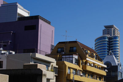 Low angle view of modern buildings against clear sky