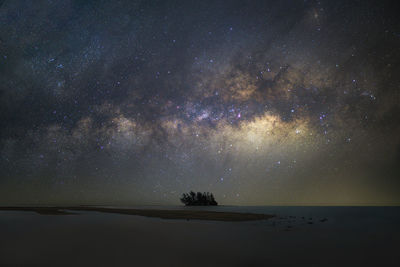 Scenic view of sea against sky at night