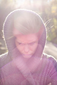 Angry woman wearing sweater in sunny day