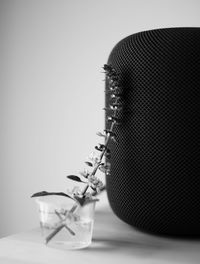 Close-up of guitar on table against white background