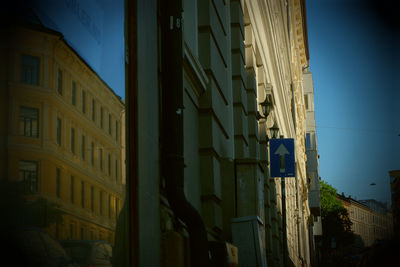 Low angle view of buildings against blue sky