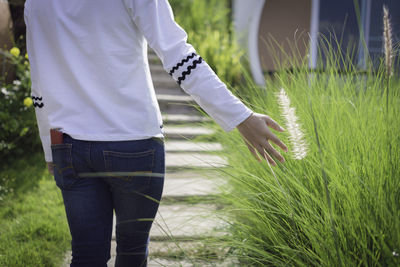 Rear view of man standing on field