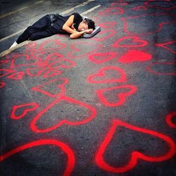 Woman lying on the road