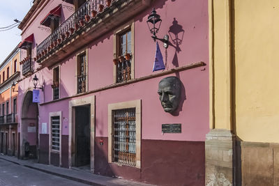 Low angle view of statue against building