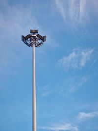 Low angle view of security camera against sky