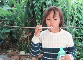 Girl blowing bubbles