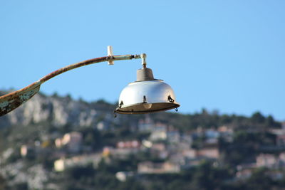 Low angle view of street light against clear sky