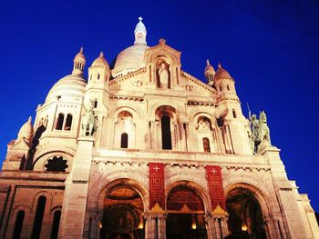 Low angle view of cathedral against blue sky