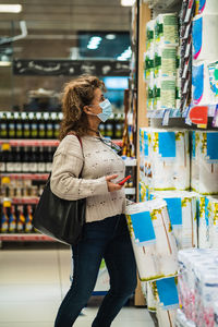 Full length of woman standing in store