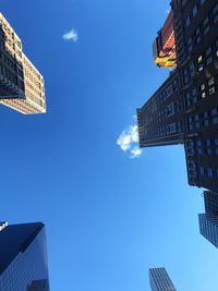 Low angle view of building against blue sky