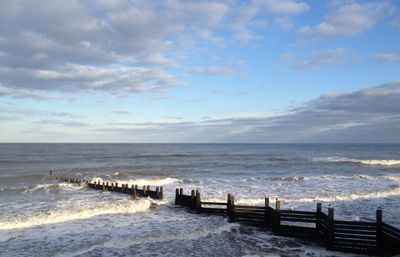 Scenic view of beach against sky