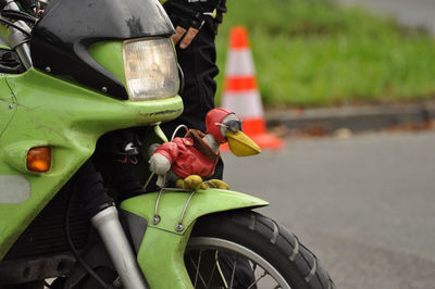 Pelican figure on the fender of a green bmw motorcycle in rating, germany