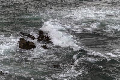 Waves splashing on rocks