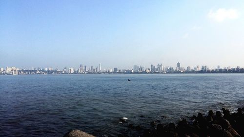 View of cityscape against blue sky