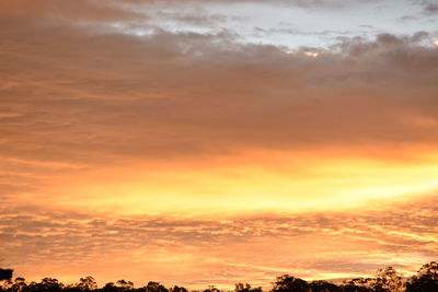 Low angle view of cloudy sky at sunset