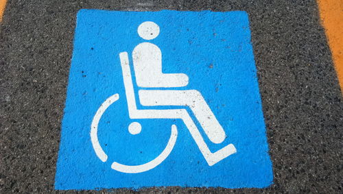 High angle view of disabled sign on road