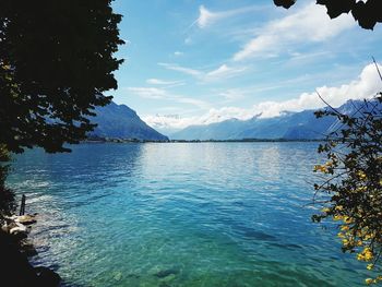 Scenic view of lake against cloudy sky