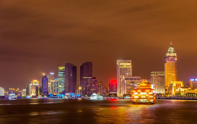 Illuminated buildings in city at night