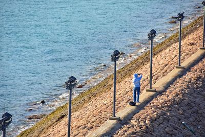 High angle view of people on beach by sea