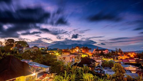 High angle view of townscape against cloudy sky