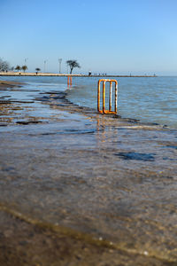 Ladder on the pier from the lake