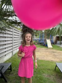 Portrait of cute girl with balloons