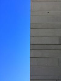 Low angle view of building against blue sky