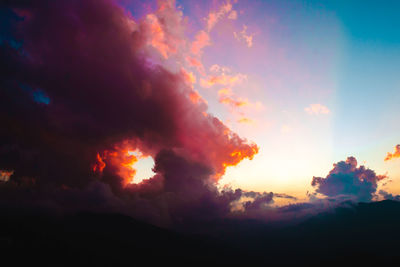 Low angle view of dramatic sky during sunset