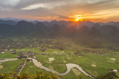 Landscape against sky during sunset