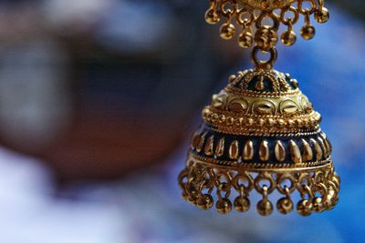 Close-up of ornate hanging on metal