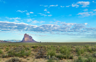 Scenic view of landscape against cloudy sky