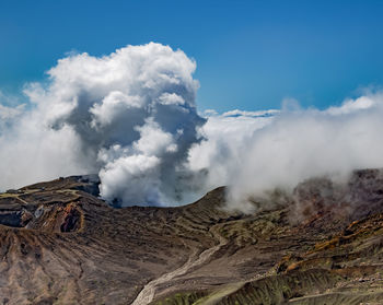 Heavy smoke bursting out from active volcano crater of aso in kyushu, japan