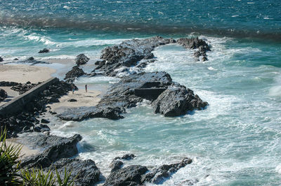 High angle view of rocks in sea