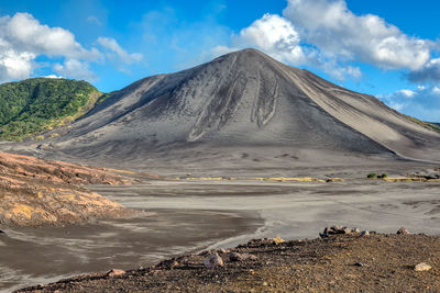 Scenic view of volcanic landscape against sky