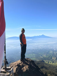 Rear view of man looking at mountains