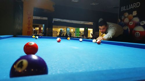 Man playing with ball at home