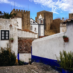 Medieval castle and church in obidos, portugal. 