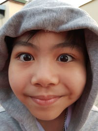 Close-up portrait of cute boy smiling